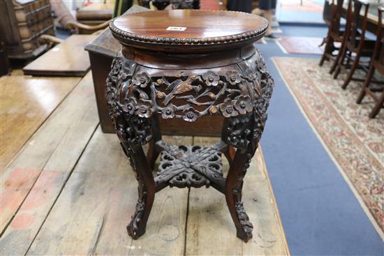 A pair of 19th century Chinese carved hardwood jardiniere stands